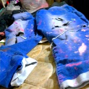 That are blue jeans that have paint splatter